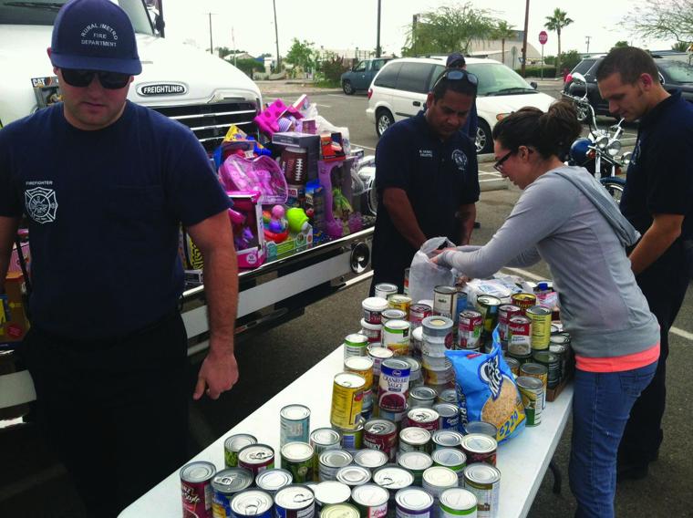 Firefighters donate food and toys to family shelter - Yuma Sun