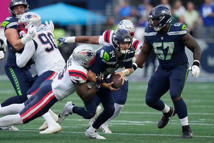 Photos of the NFL season opener, a rare Super Bowl rematch between the Seahawks and Patriots