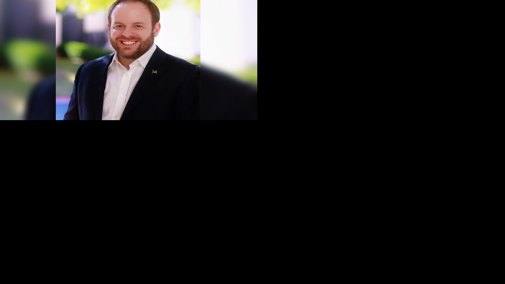 Zach Conine Headshot (blurred BG)