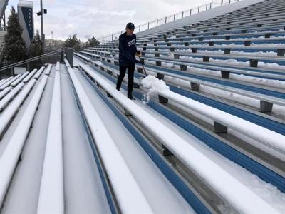 Staff, Volunteers Shovel Mackay Stadium Snow Ahead of Rivalry Game