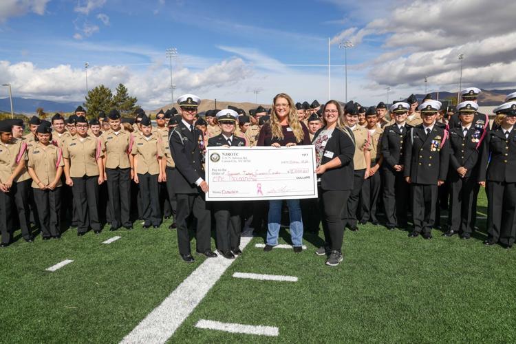 CHS NJROTC Cadets present a check to Angelina Craig director of philanthropy and Brittany Munns philanthropy coordinator at Carson Tahoe Health (002).JPG