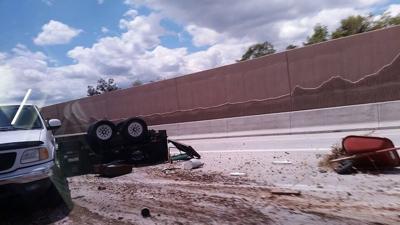 Overturned Utility Trailer on SB 395, No Injuries