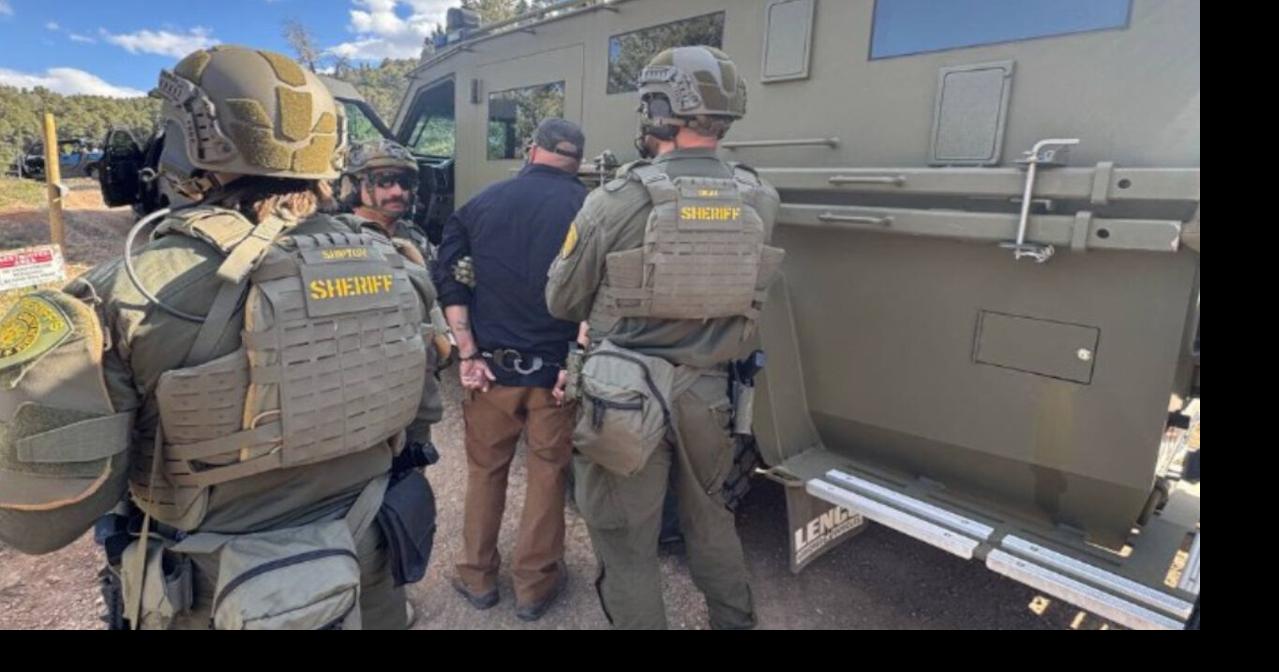 Suspect wanted on domestic violence charges surrenders after hours of ...