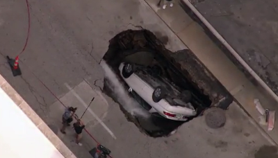 Sinkhole Swallows Up Car in Downtown St. Louis; No Injuries