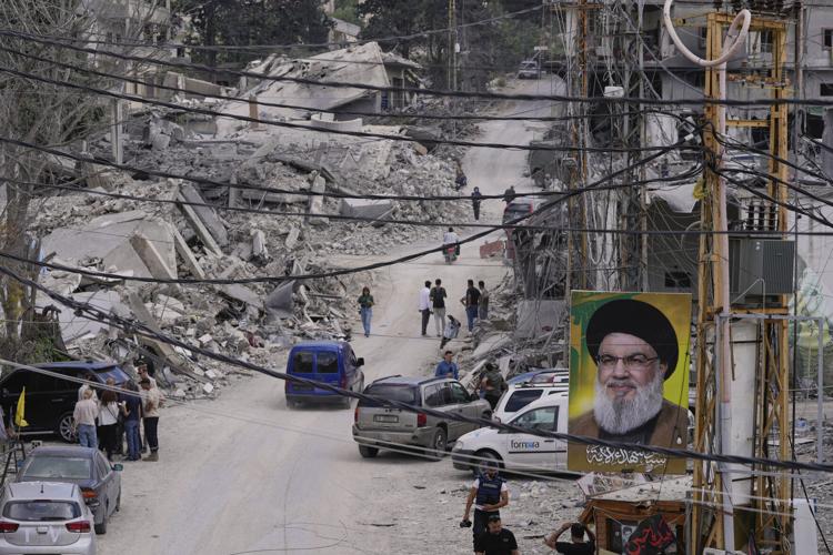 Lebanese return home to destruction after word of an initial US-Iran deal, in photos
