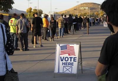 People wait to vote in-person at Reed High School in Sparks, Nev., prior to polls closing on Nov. 3, 2020.
