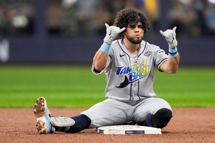 Photos of the Brewers and Rays battling for their first World Series title