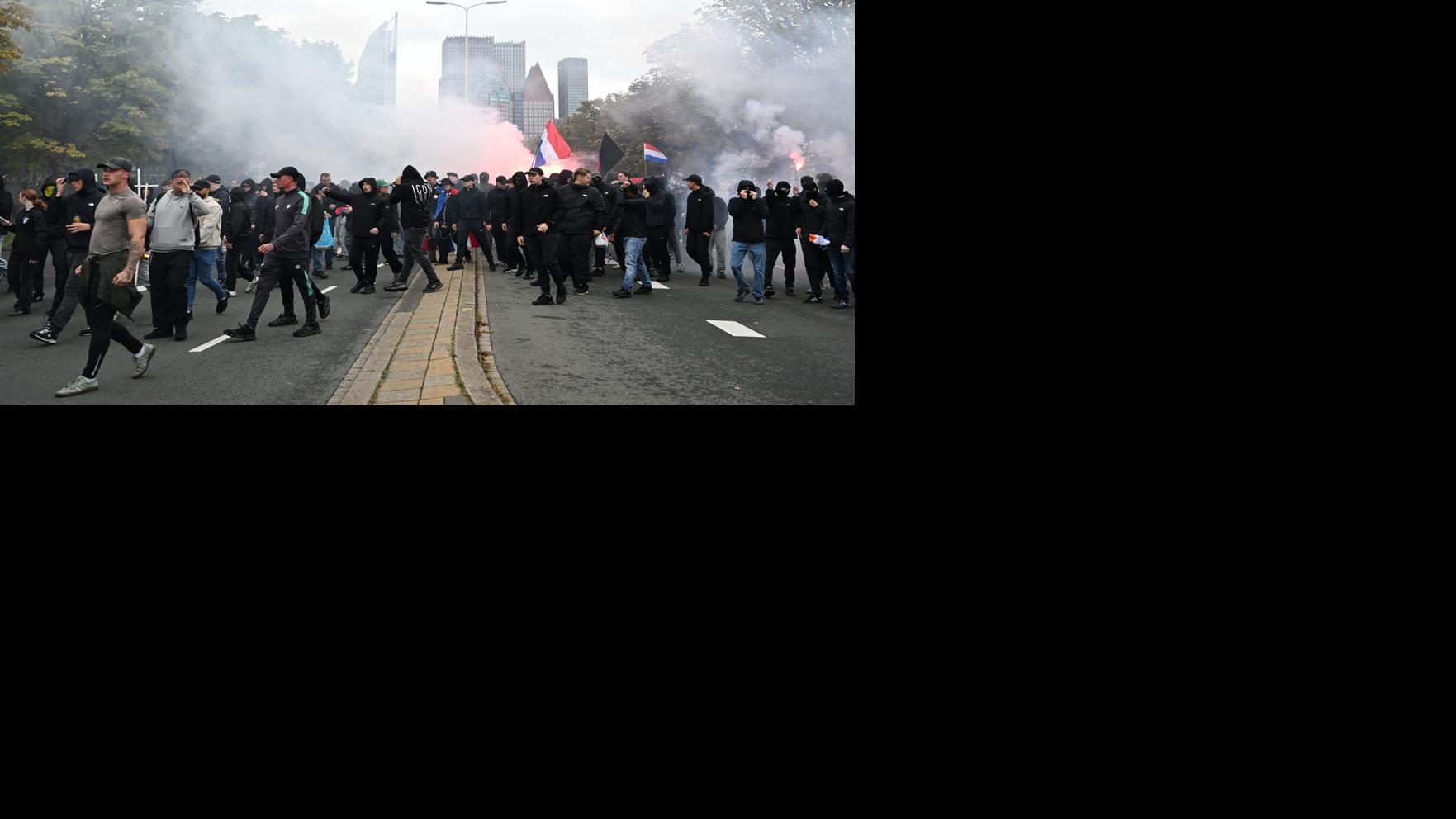 Dutch riot police break up far-right protest in The Hague after ...
