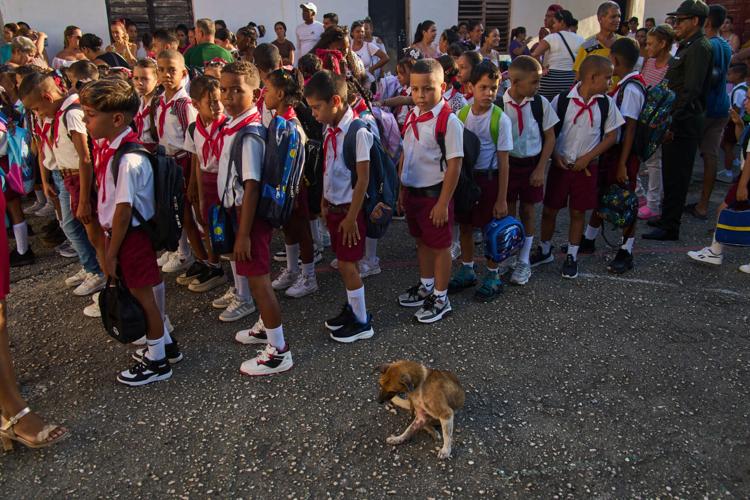 Photos of Cuban students returning to school as they face power and fuel shortages