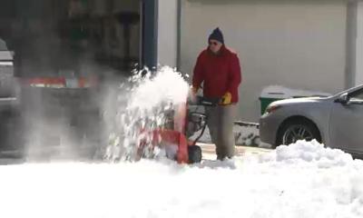 Residents Shoveling Snow from Driveways, Sidewalks After Heavy Snowfall