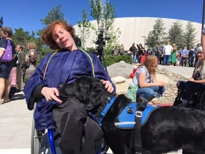 High School Senior Graduates with Canine Companion