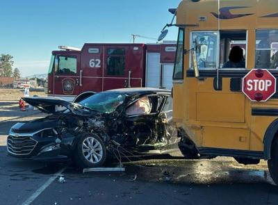 School bus hits car