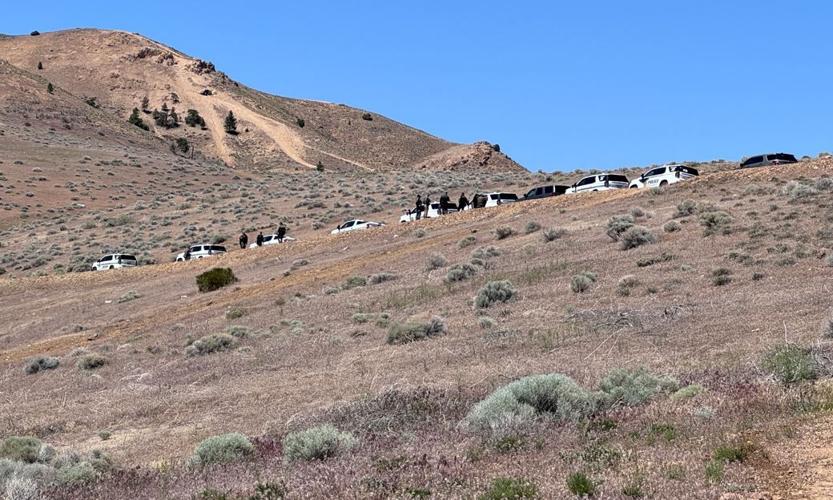 Police seen along ridgeline near Lois Allen