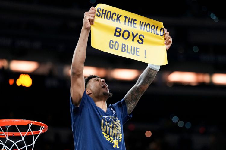 APTOPIX NCAA UConn Michigan Basketball