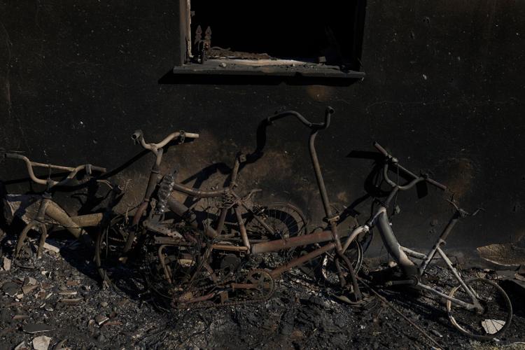 Photos show destruction from wildfires in Greece as blazes take hold in Europe and parts of the US