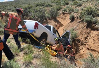 TMFPD Crews Rescue Person From Truck Down Embankment