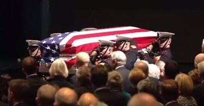 Mourners Pack Auditorium for Glenn Memorial