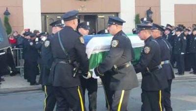 Fellow NY Officers Salute Flag-Draped Casket