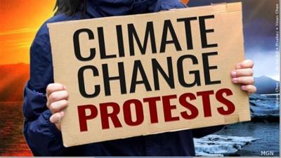Climate change protest sign