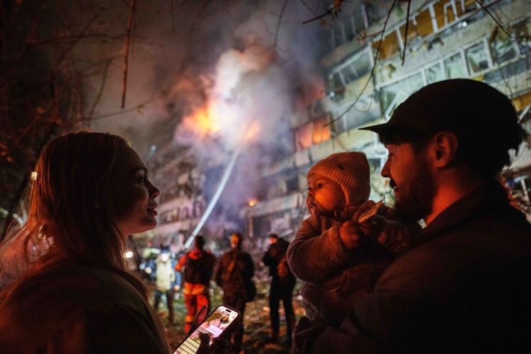 Photos of Ukrainian residents escaping their burning homes after deadly Russian attacks