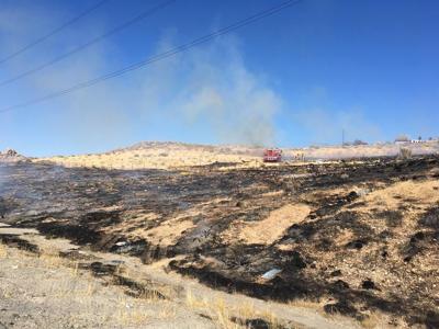 Crews Says Multiple Fires Broke Out Along Highway 395 Near Parr Blvd.