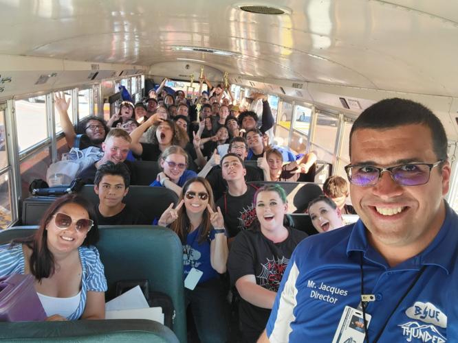 CHS Blue Thunder Marching Band celebrates their first place win with the trophies on the bus ride home Saturday Oct. 1 2022 (002).jpg