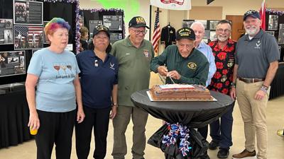 Anthony Pagano cuts cake to celebrate 250th anniversary of Army, Navy, & Marines