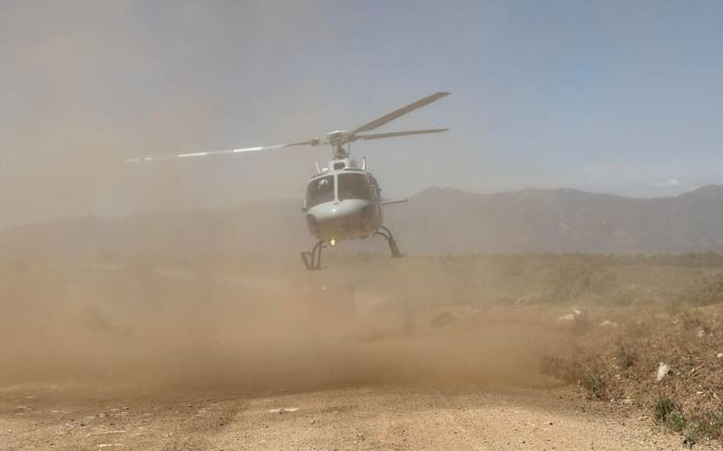 Helicopter airlfifting bicycle rider