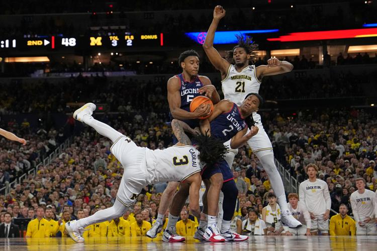 APTOPIX NCAA UConn Michigan Basketball