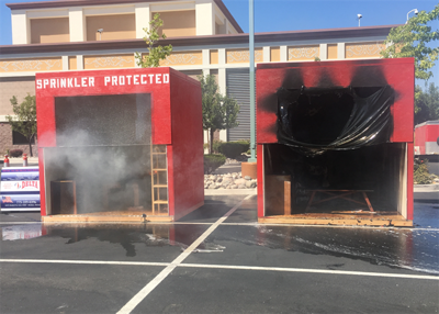 Live Burn Demonstration Shows Benefits Of Sprinklers