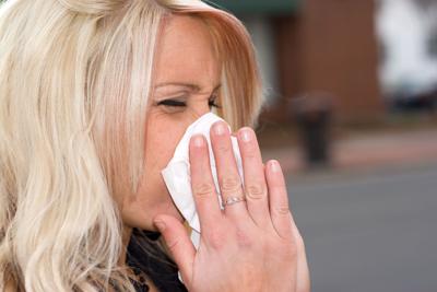 Blowing Her Nose
