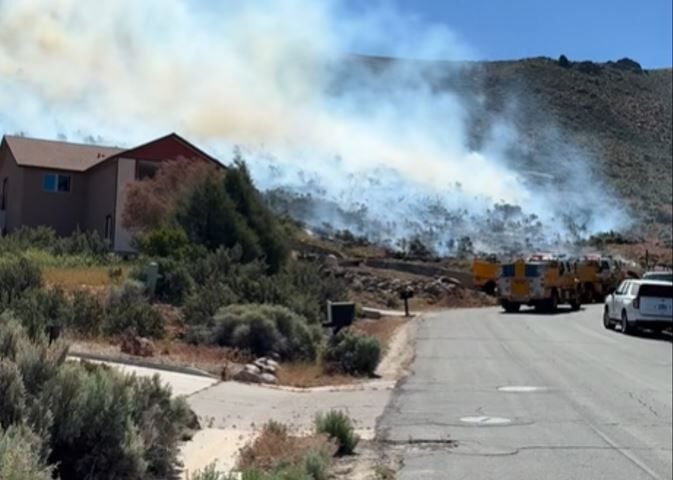 Carson fire near hill, homes