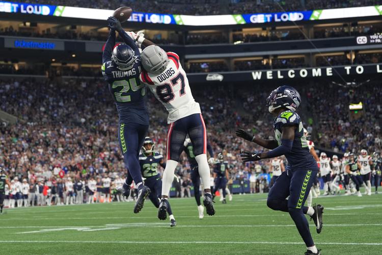 Photos of the NFL season opener, a rare Super Bowl rematch between the Seahawks and Patriots