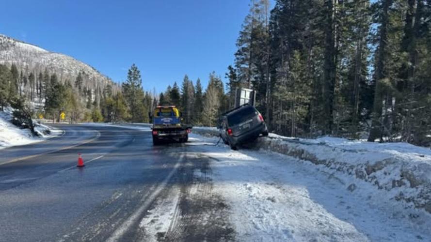Snowy recovery of a car on the shoulder