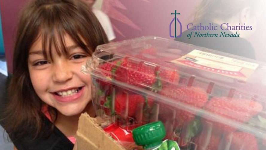 Catholic Charities of Northern Nevada  - Girl with Strawberries