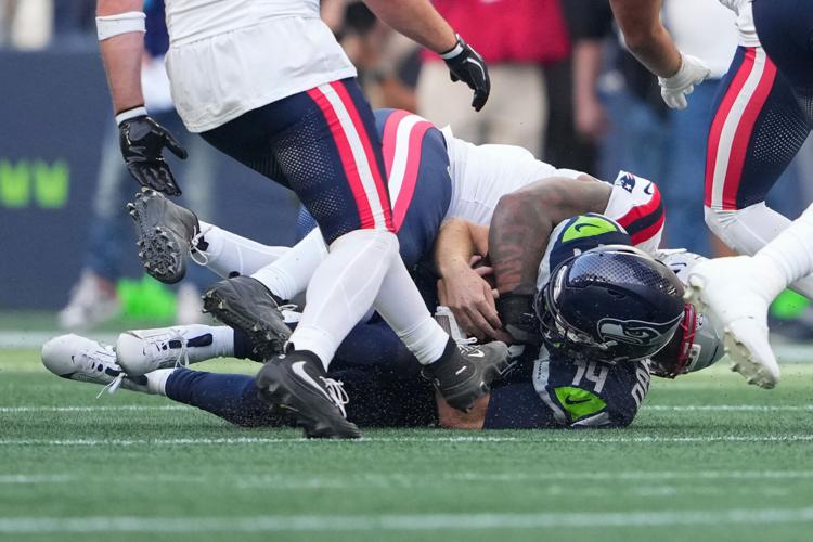Photos of the NFL season opener, a rare Super Bowl rematch between the Seahawks and Patriots