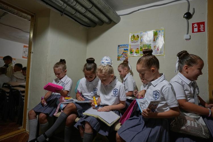 Pupils return to school in Russia and Ukraine as Kyiv students shelter from air raids, in photos
