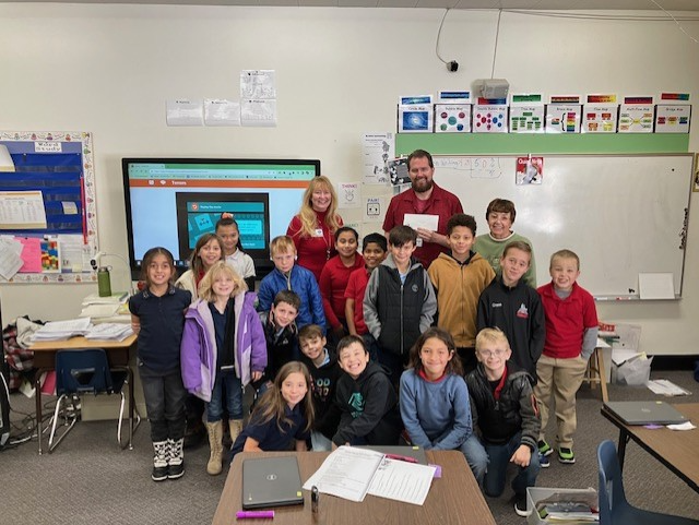 Brian Peterson and 3rd grade class at Seeliger as he accepts mini grant for books for SEL_ (002).png