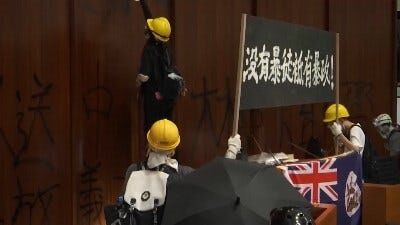 Hong Kong Protesters Clash With Police, Break Into Legislative Chamber