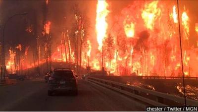 Firefighters Try To "Get Death Grip" On Massive Canada Wildfire