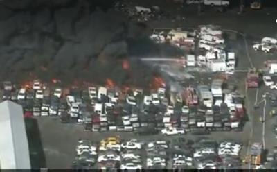 Fire at LA junkyard sends huge black plume over city