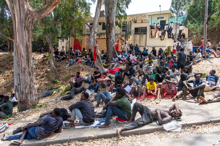 Migrants cross into Spain’s Ceuta enclave from Morocco, in photos