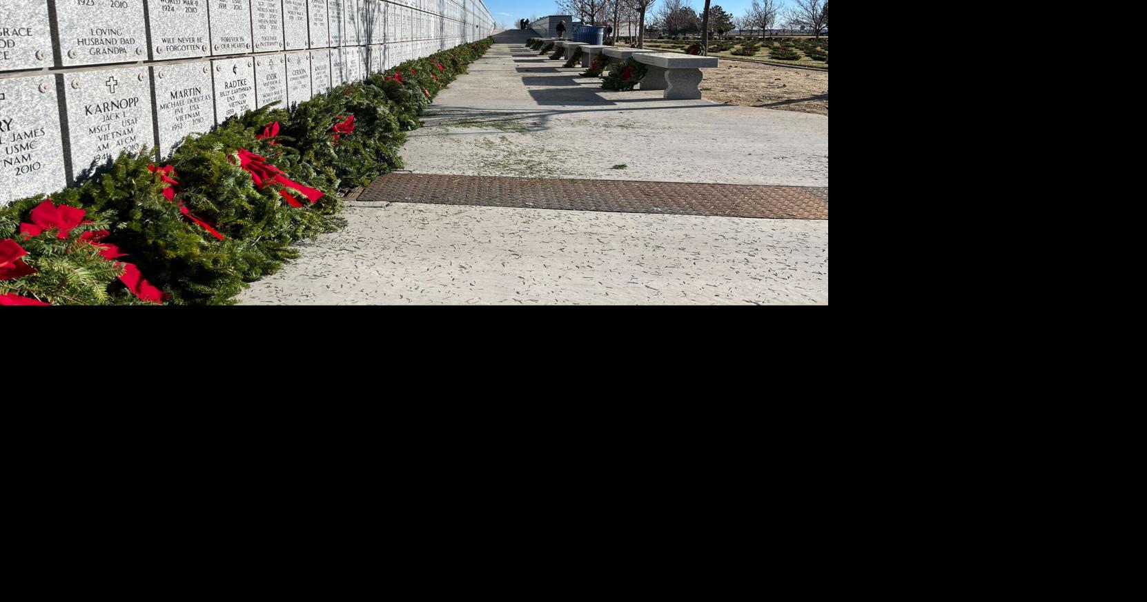 Volunteers and family members honor veterans at Wreaths Across America ...