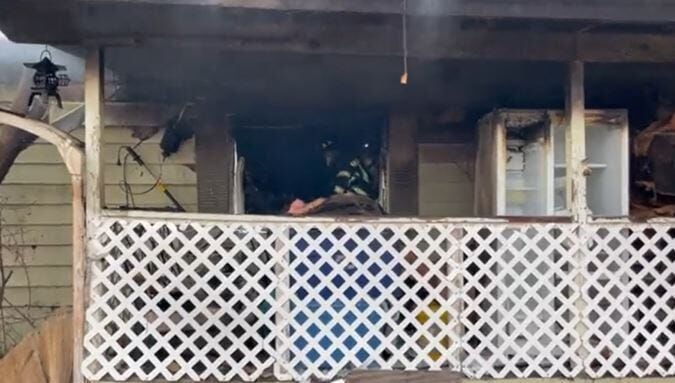 Officials: Trailer Destroyed in Fire, 2 People, 6 Dogs, 1 Cat Not Hurt