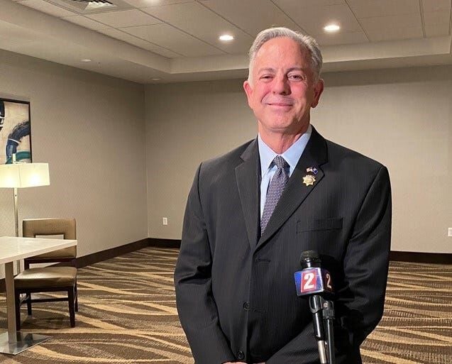 Newly elected sheriff Joe Lombardo,left, and his daughter Morgan