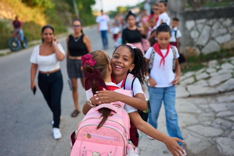 Photos of Cuban students returning to school as they face power and fuel shortages