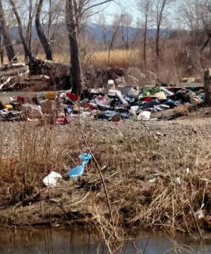 Garbage Island Builds Up Near Rock Park Ahead of Possible Flooding