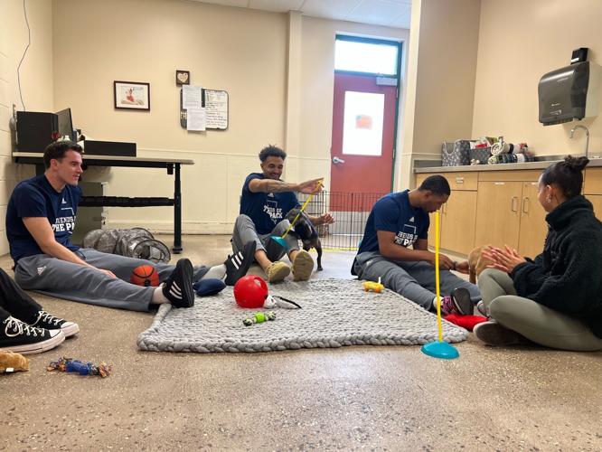 Nevada Wolf Pack Players Visit Nevada Humane Society For National Puppy Day