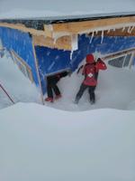 palisades Patrol climbing into patrol shack on March 13 after a heavy snow night.