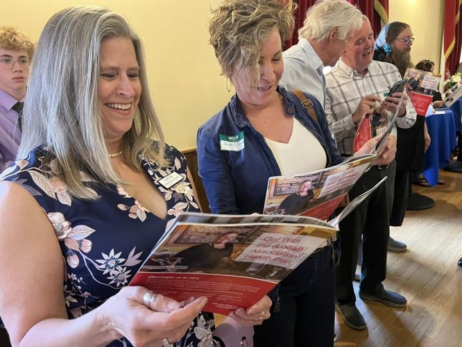Business owners enjoy thumbing through the Entrepreneurs In Action Magazine at the launch party Thursday, April 10